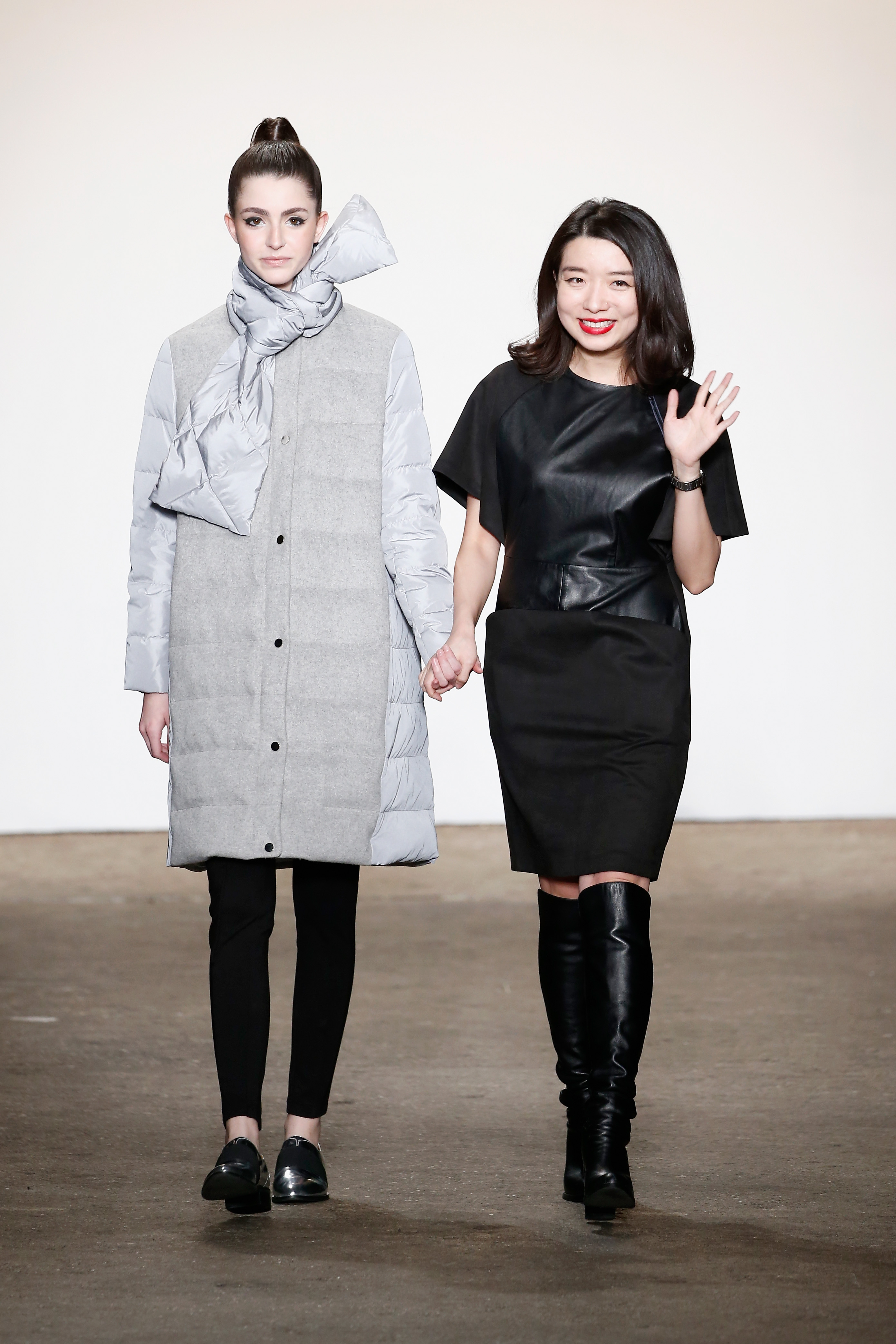 NEW YORK, NY - FEBRUARY 15: Designer Eva Yiwei Xu (R) walks the runway with a model wearing All Comes From Nothing at Nolcha Shows During New York Fashion Week Women's Fall/Winter 2016 Presented By Neogrid at ArtBeam on February 15, 2016 in New York City. (Photo by Brian Ach/Getty Images For Nolcha) *** Local Caption *** Eva Yiwei Xu